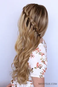 Side swept waterfall braid